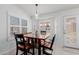 Inviting dining area with natural light and modern light fixture at 1341 E Bellerive Dr, Chandler, AZ 85249