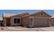 Charming single-story home with well-maintained landscaping and two-car garage at 1341 E Bellerive Dr, Chandler, AZ 85249