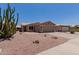 Welcoming home exterior with a two-car garage, desert landscaping, and beautiful curb appeal at 1341 E Bellerive Dr, Chandler, AZ 85249
