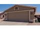 Close-up of a two-car garage, desert landscaping, and a clean, well-maintained exterior at 1341 E Bellerive Dr, Chandler, AZ 85249