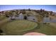 Scenic aerial view of a lush green golf course with mature trees and serene water features at 1341 E Bellerive Dr, Chandler, AZ 85249
