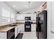Well-equipped kitchen with granite countertops and black appliances at 1341 E Bellerive Dr, Chandler, AZ 85249