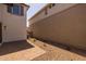 Backyard features a brick patio and low-maintenance desert landscaping near the home's exterior at 13465 N 158Th Ave, Surprise, AZ 85379