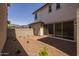 Backyard with a brick patio, low maintenance desert landscaping, and block wall fencing at 13465 N 158Th Ave, Surprise, AZ 85379