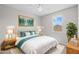 Well-decorated bedroom with an array of colorful art, decor and coordinated lamps and furniture at 13465 N 158Th Ave, Surprise, AZ 85379