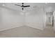 Empty bedroom features a ceiling fan, carpeted floors, and neutral walls at 13465 N 158Th Ave, Surprise, AZ 85379