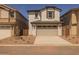 Charming two-story home featuring a two-car garage, neutral colors, and low maintenance landscaping at 13465 N 158Th Ave, Surprise, AZ 85379
