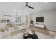 Tastefully decorated living space with stylish furniture, a large flat-screen TV, and an open layout at 13465 N 158Th Ave, Surprise, AZ 85379