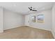 Bright and airy main bedroom with tile floors, a ceiling fan, and large windows offering plenty of natural light at 13465 N 158Th Ave, Surprise, AZ 85379