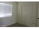 Neutral bedroom with new carpet, a closet, and a window with blinds at 1450 E Laurel Ave, Gilbert, AZ 85234