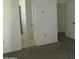 Bedroom features neutral carpeting and paint, with doorways to other rooms in the home at 1450 E Laurel Ave, Gilbert, AZ 85234