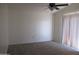 Bright bedroom with ceiling fan and sliding glass door leading to the backyard area at 1450 E Laurel Ave, Gilbert, AZ 85234