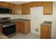 Modern kitchen featuring stainless steel appliances, ample cabinet space, and granite countertops at 1450 E Laurel Ave, Gilbert, AZ 85234