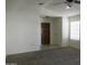 Bright living room featuring neutral paint, new carpet, and a view of the front entrance at 1450 E Laurel Ave, Gilbert, AZ 85234