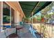 Covered back porch offering a relaxing outdoor space with wrought iron furniture and garden views at 14622 N 45Th Pl, Phoenix, AZ 85032