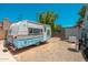 Charming camper in a spacious backyard setting under a blue sky at 14622 N 45Th Pl, Phoenix, AZ 85032