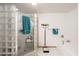 Bright bathroom features glass block shower, towel racks, scale and soaking tub at 14622 N 45Th Pl, Phoenix, AZ 85032