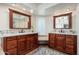 Dual vanity sinks with granite countertops, framed mirrors and stylish fixtures in bright bathroom at 14622 N 45Th Pl, Phoenix, AZ 85032