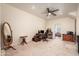 Spacious bedroom featuring neutral walls, carpet, ceiling fan and doorway to bright sunlight at 14622 N 45Th Pl, Phoenix, AZ 85032