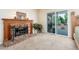 Bedroom featuring a fireplace and balcony access at 14622 N 45Th Pl, Phoenix, AZ 85032
