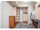 Walk-in closet with custom shelving, drawers, and a dresser with carpeted floor at 14622 N 45Th Pl, Phoenix, AZ 85032