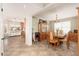 Open dining room with a large table, views of the kitchen, and plenty of natural light at 14622 N 45Th Pl, Phoenix, AZ 85032