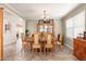 Elegant dining room with a large wooden table, chandelier, and built-in display cabinet at 14622 N 45Th Pl, Phoenix, AZ 85032