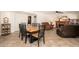This cozy dining room features a wood table and chairs with access to the living room at 14622 N 45Th Pl, Phoenix, AZ 85032
