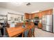 Kitchen with stainless appliances, oak cabinets and eat in dining area with natural light at 14622 N 45Th Pl, Phoenix, AZ 85032