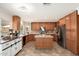 Spacious kitchen featuring an island, stainless steel appliances, and custom cabinets at 14622 N 45Th Pl, Phoenix, AZ 85032