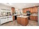 Modern kitchen featuring an island, stainless steel appliances, and custom cabinetry at 14622 N 45Th Pl, Phoenix, AZ 85032