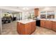 This kitchen features wood cabinets, black appliances, granite countertops, and tile flooring at 14622 N 45Th Pl, Phoenix, AZ 85032