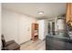 A laundry room with a washer, dryer, shelving, and a white refrigerator at 14622 N 45Th Pl, Phoenix, AZ 85032