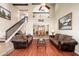 Spacious living room with comfortable seating, hardwood floors, and a view into the dining room at 14622 N 45Th Pl, Phoenix, AZ 85032