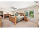 Spacious main bedroom featuring a fireplace, large windows, and neutral decor at 14622 N 45Th Pl, Phoenix, AZ 85032