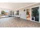 Spacious patio with tiled flooring, iron railing, ceiling fan and open door to interior space at 14622 N 45Th Pl, Phoenix, AZ 85032