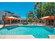Spacious backyard with a clear blue pool and multiple seating areas at 14622 N 45Th Pl, Phoenix, AZ 85032