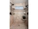 Modern tiled shower with dual shower heads, built in shelving and bright overhead lighting at 14622 N 45Th Pl, Phoenix, AZ 85032