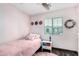 Pink themed bedroom with carpet and a ceiling fan at 14885 W Ashland Ave, Goodyear, AZ 85395