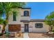 Inviting two-story home featuring low maintenance landscaping and a charming brick facade at 14885 W Ashland Ave, Goodyear, AZ 85395