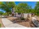 Inviting two-story home featuring low maintenance landscaping and a charming brick facade at 14885 W Ashland Ave, Goodyear, AZ 85395