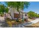Inviting two-story home featuring low maintenance landscaping and a charming brick facade at 14885 W Ashland Ave, Goodyear, AZ 85395
