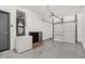 Clean garage with epoxy floors, garage door opener, and secondary refrigerator and freezer at 14885 W Ashland Ave, Goodyear, AZ 85395