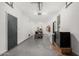Spacious garage with epoxy floors, overhead lighting, and extra refrigerator and freezer at 14885 W Ashland Ave, Goodyear, AZ 85395