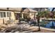 Expansive backyard with pool, patio furniture, and beautiful desert landscaping at 15861 W Westview Dr, Goodyear, AZ 85395