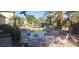 Beautiful pool area with seating and lush landscaping creating a serene outdoor retreat at 15861 W Westview Dr, Goodyear, AZ 85395