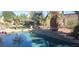 Backyard pool with beautiful water feature and lush landscaping creating a backyard paradise at 15861 W Westview Dr, Goodyear, AZ 85395