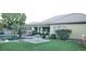 Beautiful backyard pool area featuring lush landscaping and comfortable patio seating at 15861 W Westview Dr, Goodyear, AZ 85395