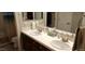 Bathroom boasting dual sinks and tiled countertop at 15861 W Westview Dr, Goodyear, AZ 85395