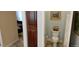 Powder room with vanity sink, toilet, and view of bedroom at 15861 W Westview Dr, Goodyear, AZ 85395